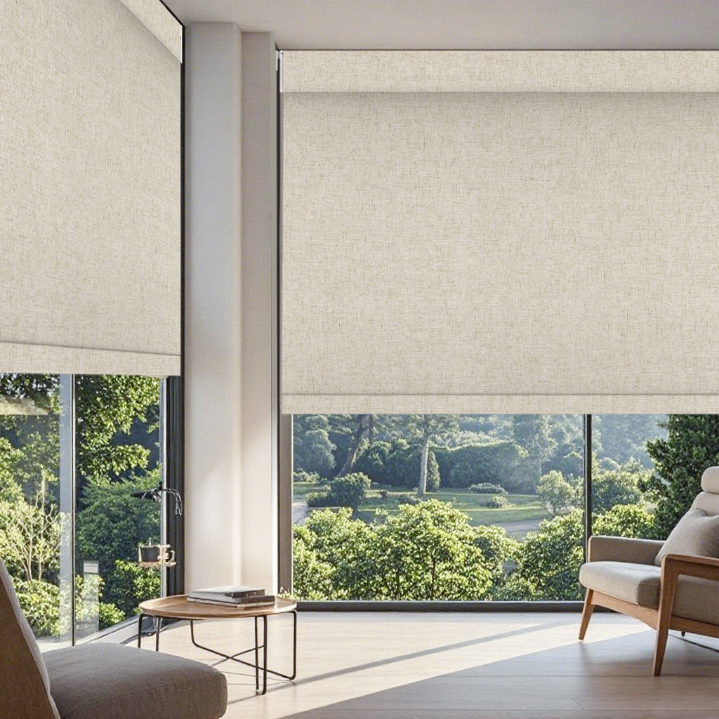 No drill motorized roller shades in a bright living room with beige sofa, wooden coffee table, decorative plants, and natural light coming through the windows