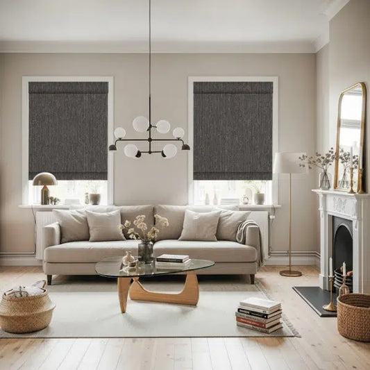 No-drill motorized roller shades in a modern living room with beige sofa, glass coffee table, and natural light.